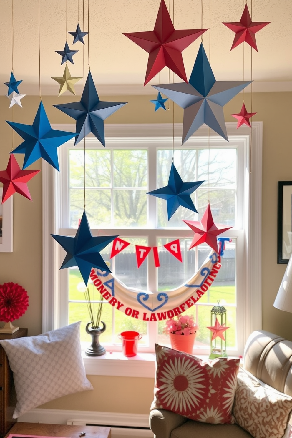 A cozy living room adorned with DIY paper stars hanging from the ceiling creates a festive atmosphere. The stars are crafted in various sizes and colors, adding a playful touch to the space. The window features a charming display with seasonal decorations that celebrate Labor Day. Red, white, and blue accents complement the natural light streaming in, enhancing the inviting ambiance.