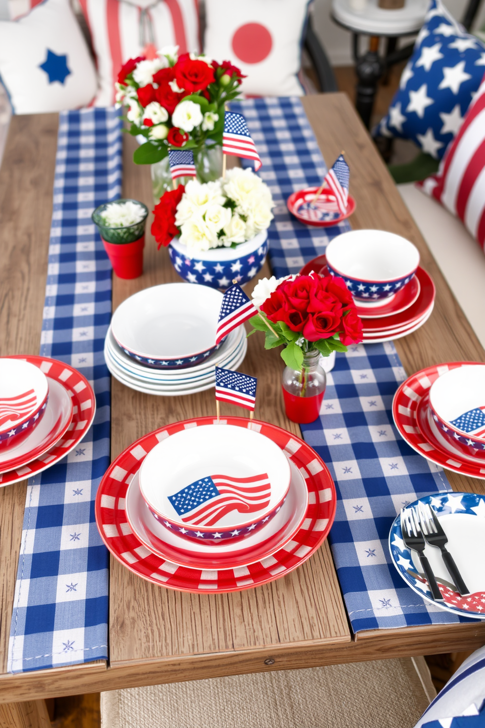 Patriotic themed dishware featuring red white and blue colors with stars and stripes patterns. The set includes plates bowls and serving platters arranged on a rustic wooden dining table adorned with a blue and white checkered tablecloth. Incorporate festive decorations such as small American flags and fresh flowers in red white and blue hues. Use comfortable seating with coordinating cushions to create a warm inviting atmosphere for Memorial Day celebrations.