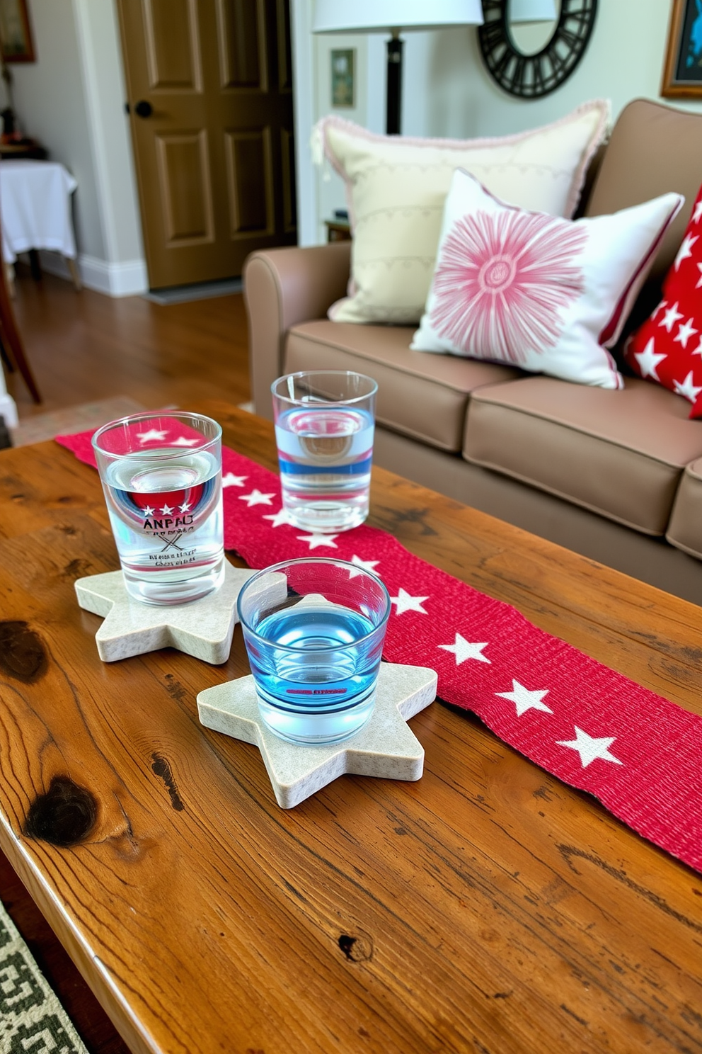 Star shaped coasters for drinks are arranged on a rustic wooden coffee table. The coasters are made of natural stone with a subtle star pattern, adding a festive touch to the apartment decor. For Memorial Day, the apartment is adorned with red, white, and blue accents. Soft throw pillows and a vibrant table runner complement the star shaped coasters, creating a cohesive and inviting atmosphere.