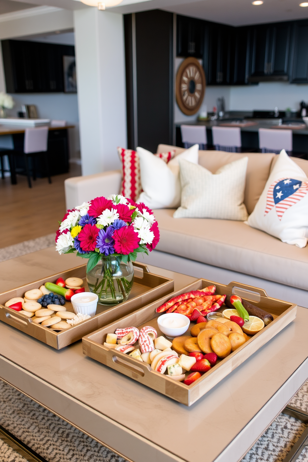 Decorative trays are arranged on a stylish coffee table, featuring an assortment of seasonal snacks like fresh fruit, colorful cookies, and homemade dips. The trays are complemented by vibrant flowers in a vase, creating a festive atmosphere for Memorial Day celebrations. The apartment is adorned with red, white, and blue accents, including throw pillows and table runners that evoke the spirit of the holiday. Soft lighting enhances the cozy ambiance, inviting guests to gather and enjoy the delicious treats.