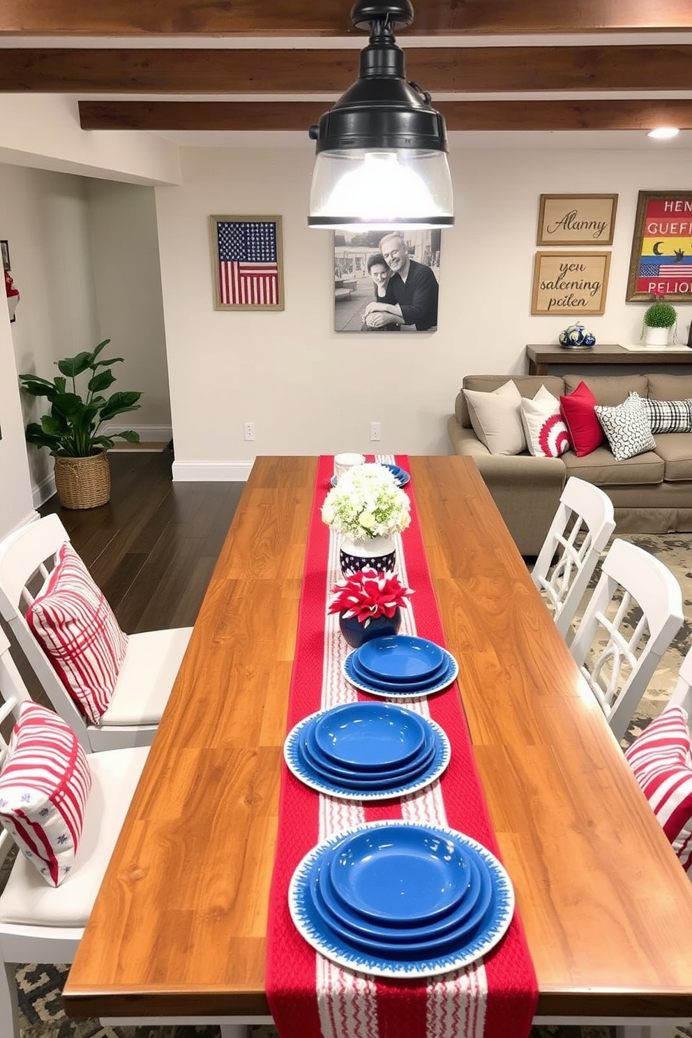 A festive Memorial Day themed table runner stretches across a long wooden dining table adorned with blue and white dishes. Red, white, and blue accents are woven into the fabric, creating a patriotic atmosphere perfect for gathering with family and friends. The basement is transformed into a cozy Memorial Day retreat with comfortable seating and themed decor. Red and blue throw pillows complement a stylish rug, while wall art featuring American flags and summer motifs adds a celebratory touch.