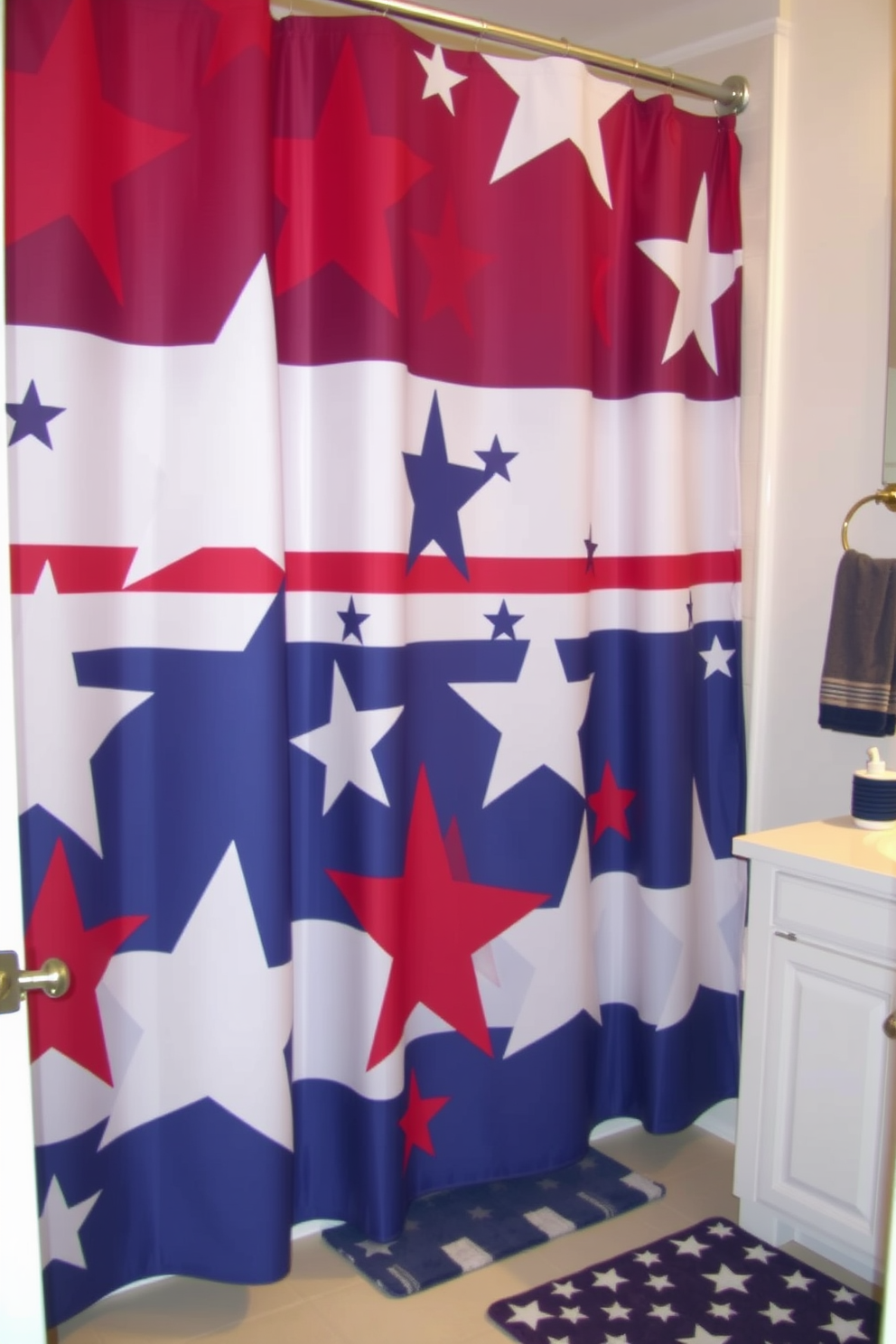 A patriotic shower curtain displays bold stars and stripes in vibrant red white and blue tones. The bathroom features subtle decor elements that complement the festive theme such as a matching bath mat and themed accessories.