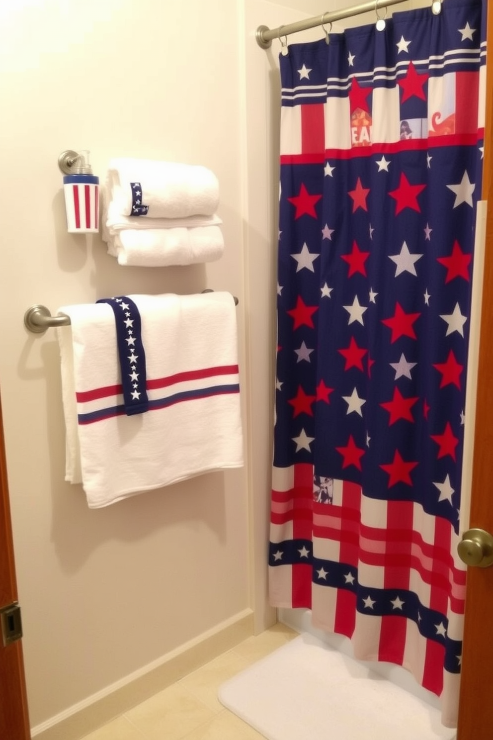 A patriotic bathroom setting featuring red white and blue bath accessories. The towels are arranged neatly on a towel rack while a decorative shower curtain showcases stars and stripes.