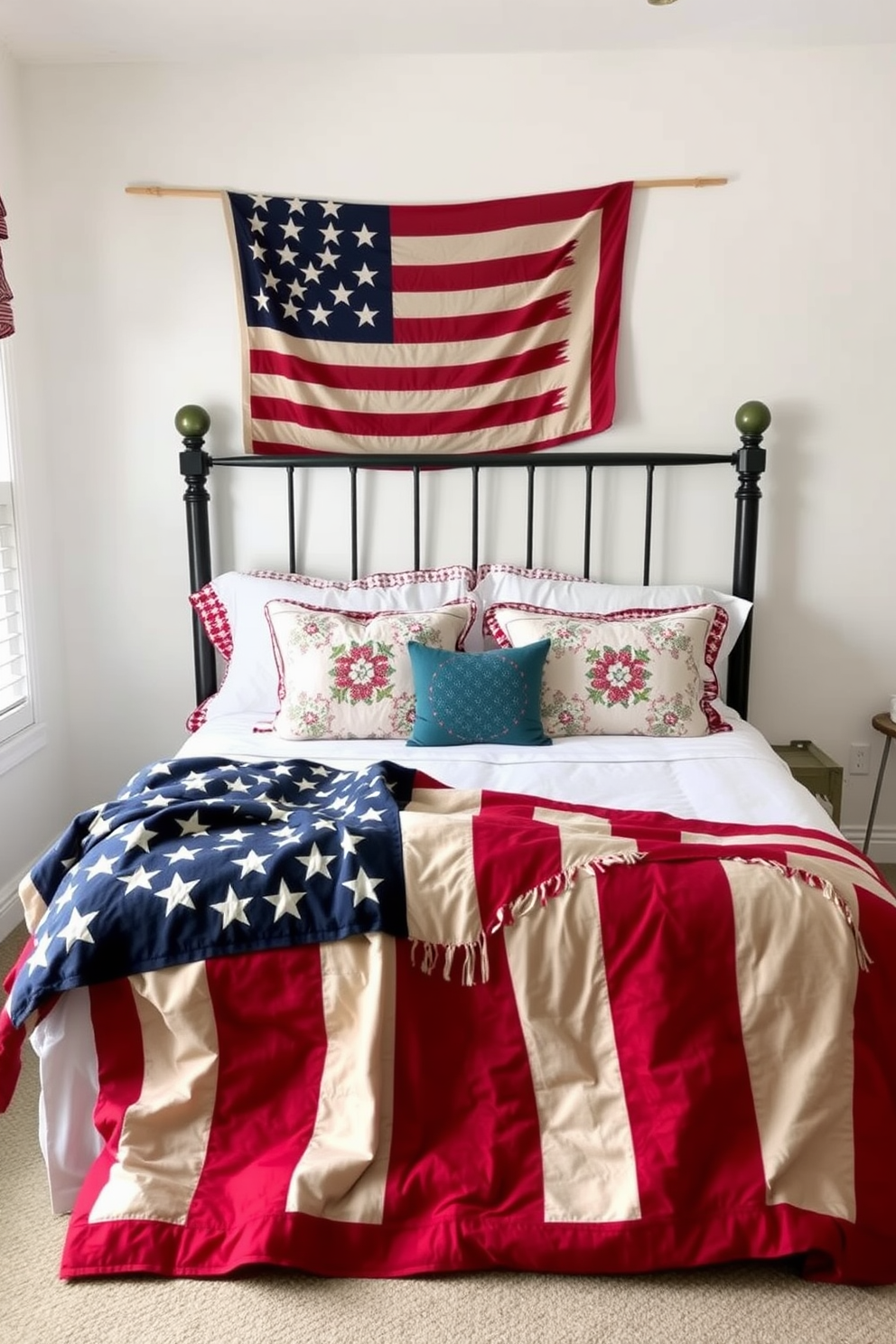 A cozy bedroom featuring a patriotic quilt draped over a neatly made bed. The walls are painted in soft white, and red, white, and blue accents are incorporated through decorative pillows and a vintage flag hanging above the headboard.