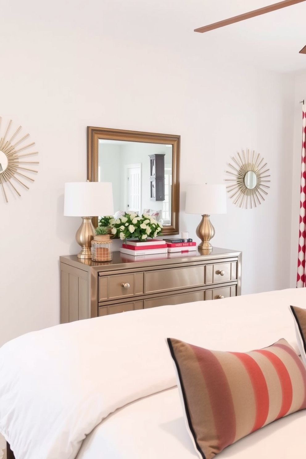 Starburst mirrors adorn the walls, reflecting light and adding a touch of glamour to the space. The mirrors create a dynamic focal point above a stylish dresser, enhancing the overall aesthetic of the room. For Memorial Day, the bedroom is decorated with red, white, and blue accents throughout. Crisp white bedding is paired with navy and striped throw pillows, creating a festive yet sophisticated atmosphere.