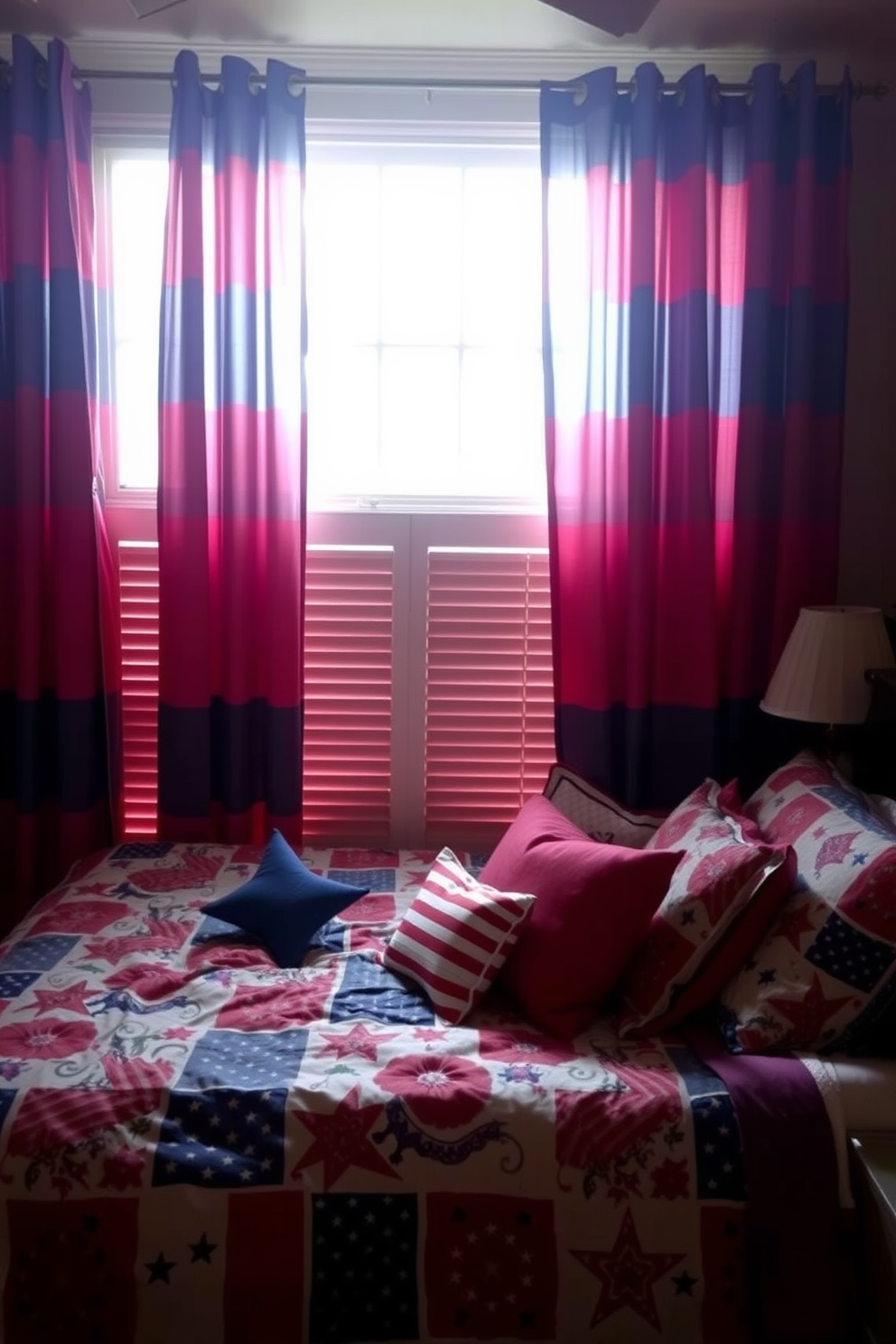 A cozy bedroom adorned with red and blue striped curtains that frame a large window, allowing natural light to filter through. The bedding features a mix of patriotic patterns, complemented by decorative pillows in solid red and blue hues.