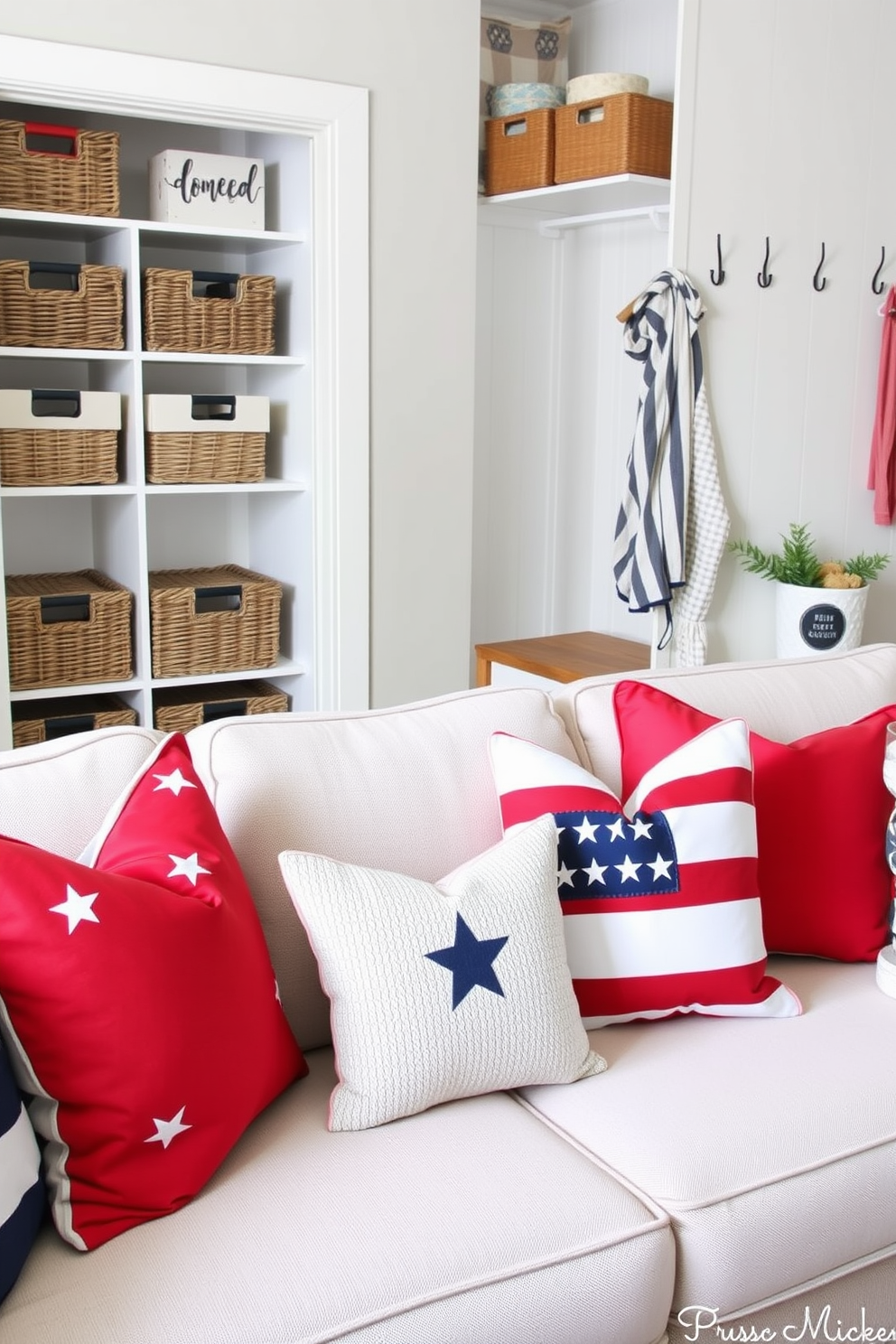 Patriotic throw pillows in vibrant red white and blue patterns are arranged on a cozy sectional sofa creating a welcoming atmosphere. The pillows feature stars and stripes designs adding a festive touch perfect for celebrating Memorial Day. The closet is organized with stylish storage solutions including woven baskets and decorative boxes. A fresh coat of paint in a soft neutral tone enhances the space while hanging hooks and a small bench provide functionality and charm.