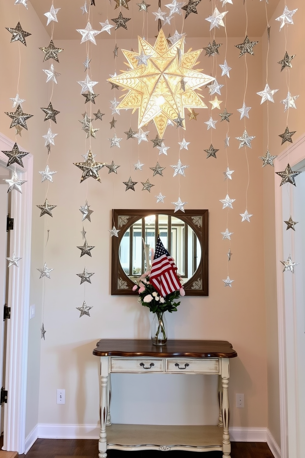 A charming entryway adorned with hanging star decorations that cascade from the ceiling. The stars are crafted from shimmering silver and gold materials, creating a festive atmosphere that welcomes guests. The walls are painted in a soft pastel hue, complementing the bright decorations. A console table with a rustic finish is placed against the wall, topped with a bouquet of fresh flowers and a small American flag to honor Memorial Day.