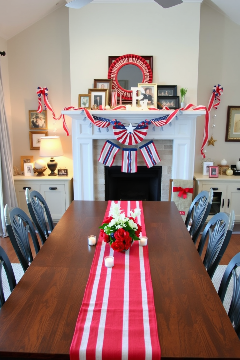 A festive dining setting featuring a red and white striped table runner elegantly draped across a long wooden table. The table is adorned with small white candles and fresh flowers in red and white hues, creating a cheerful atmosphere for Memorial Day celebrations. Above the fireplace, a decorative arrangement of patriotic-themed garlands and framed photographs pays homage to the holiday. The mantel is accented with a mix of red, white, and blue decor, including stars and stripes, enhancing the festive spirit.