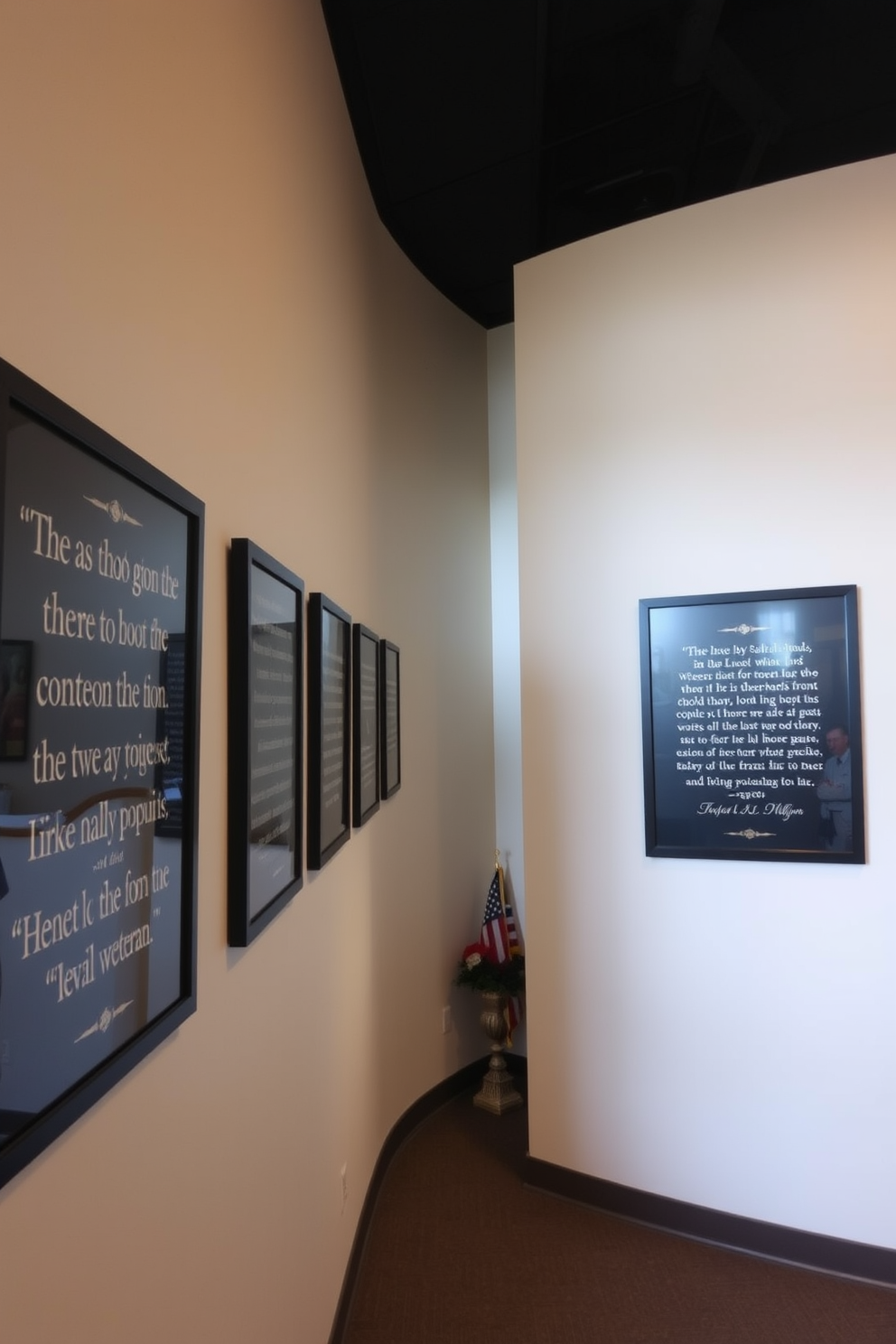 Framed quotes honoring veterans are displayed along a well-lit hallway. Each frame features a different quote, with elegant typography and a mix of black and gold finishes that complement the neutral wall color. The hallway is adorned with subtle patriotic decorations, such as small flags and red, white, and blue accents. Soft lighting highlights the quotes, creating a warm and respectful atmosphere for visitors.