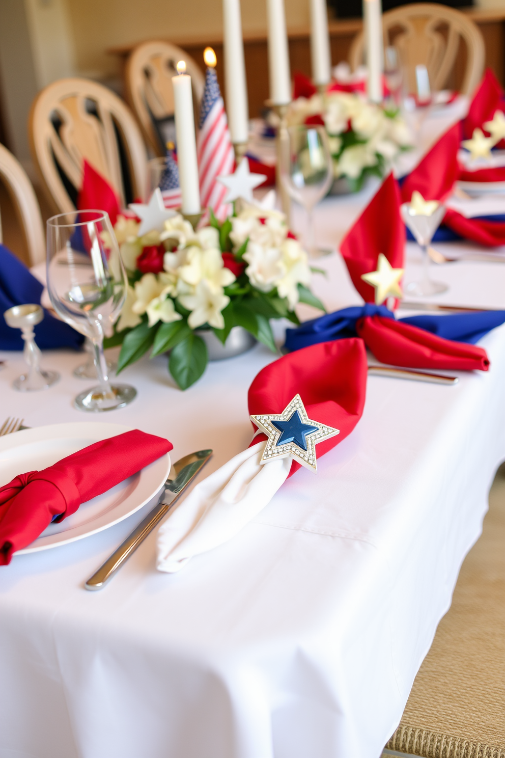 A beautifully set dining table features star-shaped napkin rings that add a touch of elegance to the decor. The table is adorned with a crisp white tablecloth, and the napkin rings are complemented by vibrant red and blue napkins for a festive Memorial Day celebration.