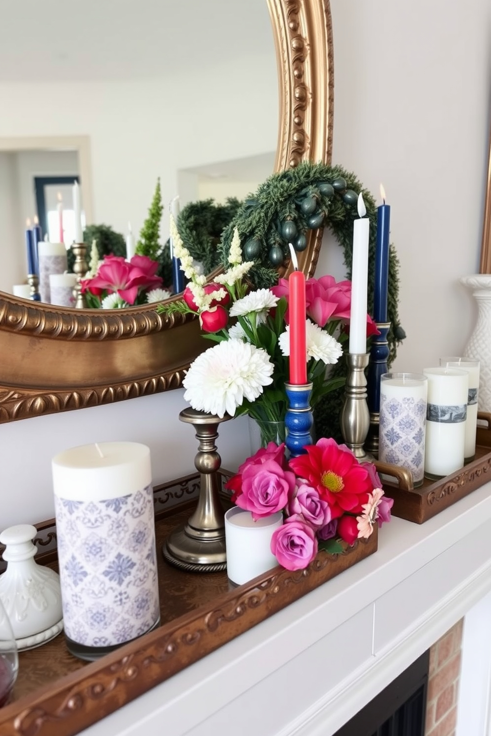 A beautifully styled mantel features decorative trays arranged with themed candles in various heights and colors. Fresh flowers in complementary hues are artfully placed among the candles, creating a festive and inviting atmosphere for Memorial Day.