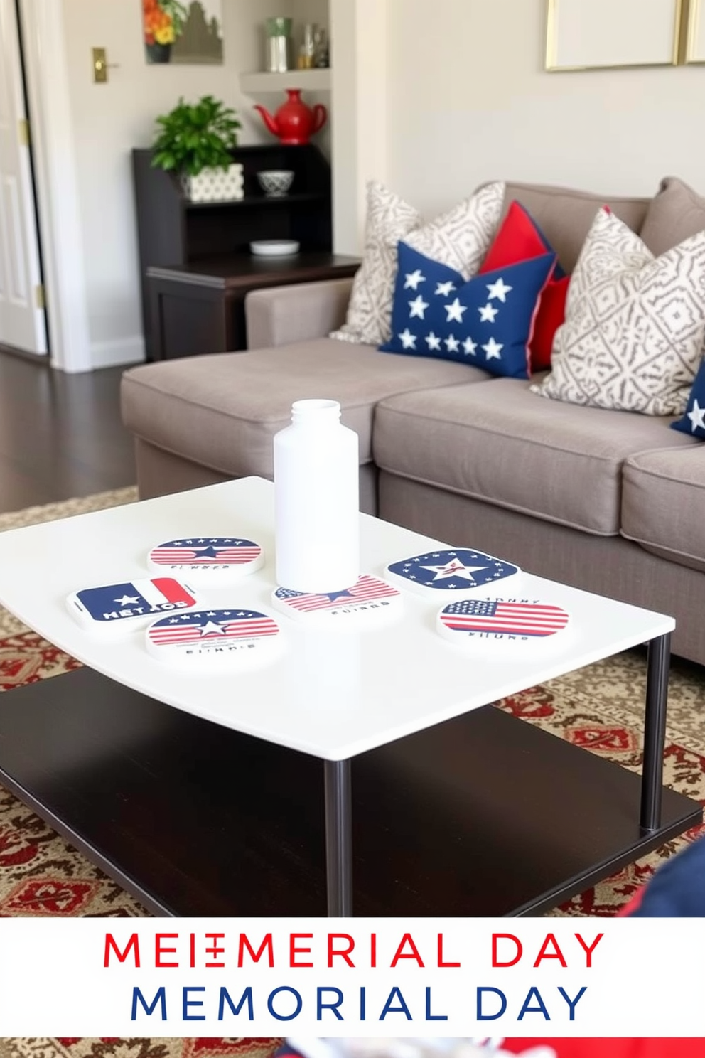 Patriotic themed coasters are arranged on a sleek coffee table in a cozy small living room. The table is surrounded by a comfortable sectional sofa adorned with red, white, and blue throw pillows, creating a festive atmosphere for Memorial Day.