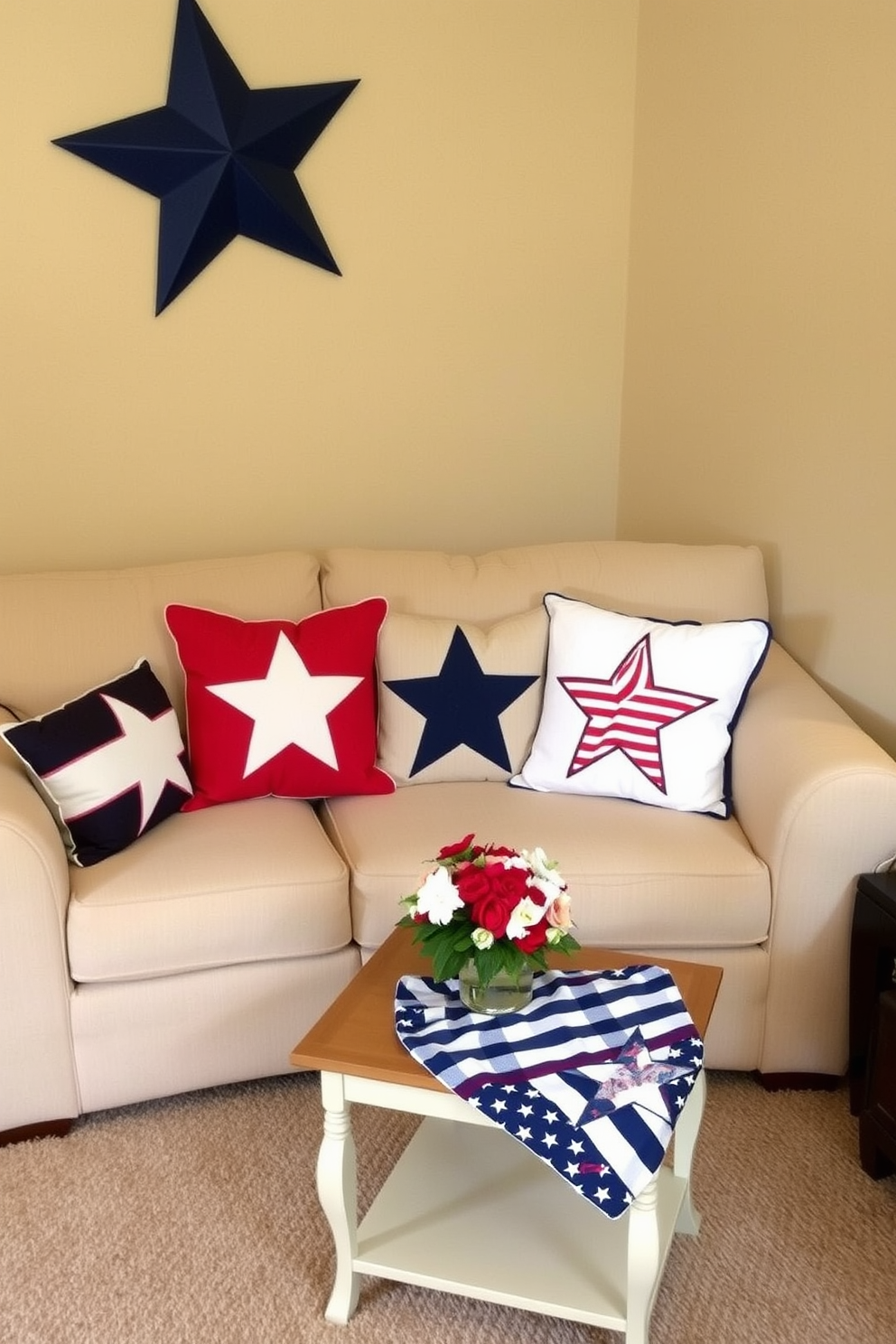 Decorative pillows with star motifs are arranged on a cozy sofa in a small living room. The pillows add a festive touch, complementing the red, white, and blue color scheme for Memorial Day. A small coffee table sits in front of the sofa, adorned with a simple centerpiece of fresh flowers. The walls are painted in a soft beige, creating a warm and inviting atmosphere perfect for holiday gatherings.