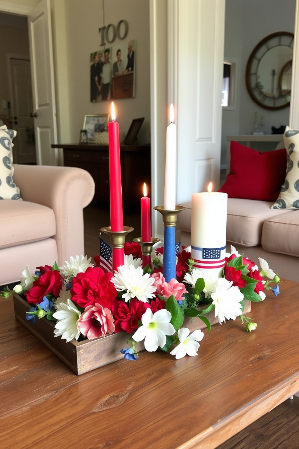 A small living room features a cozy arrangement of red white and blue candles on a rustic wooden coffee table. The candles vary in height and are surrounded by fresh flowers in patriotic colors, creating a warm and inviting atmosphere for Memorial Day celebrations.