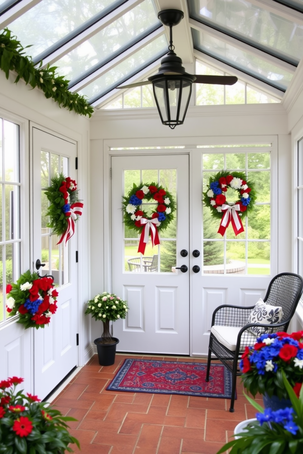 A charming sunroom adorned with seasonal wreaths on the doors and windows. The wreaths are crafted from vibrant red, white, and blue flowers, celebrating Memorial Day with a festive touch.