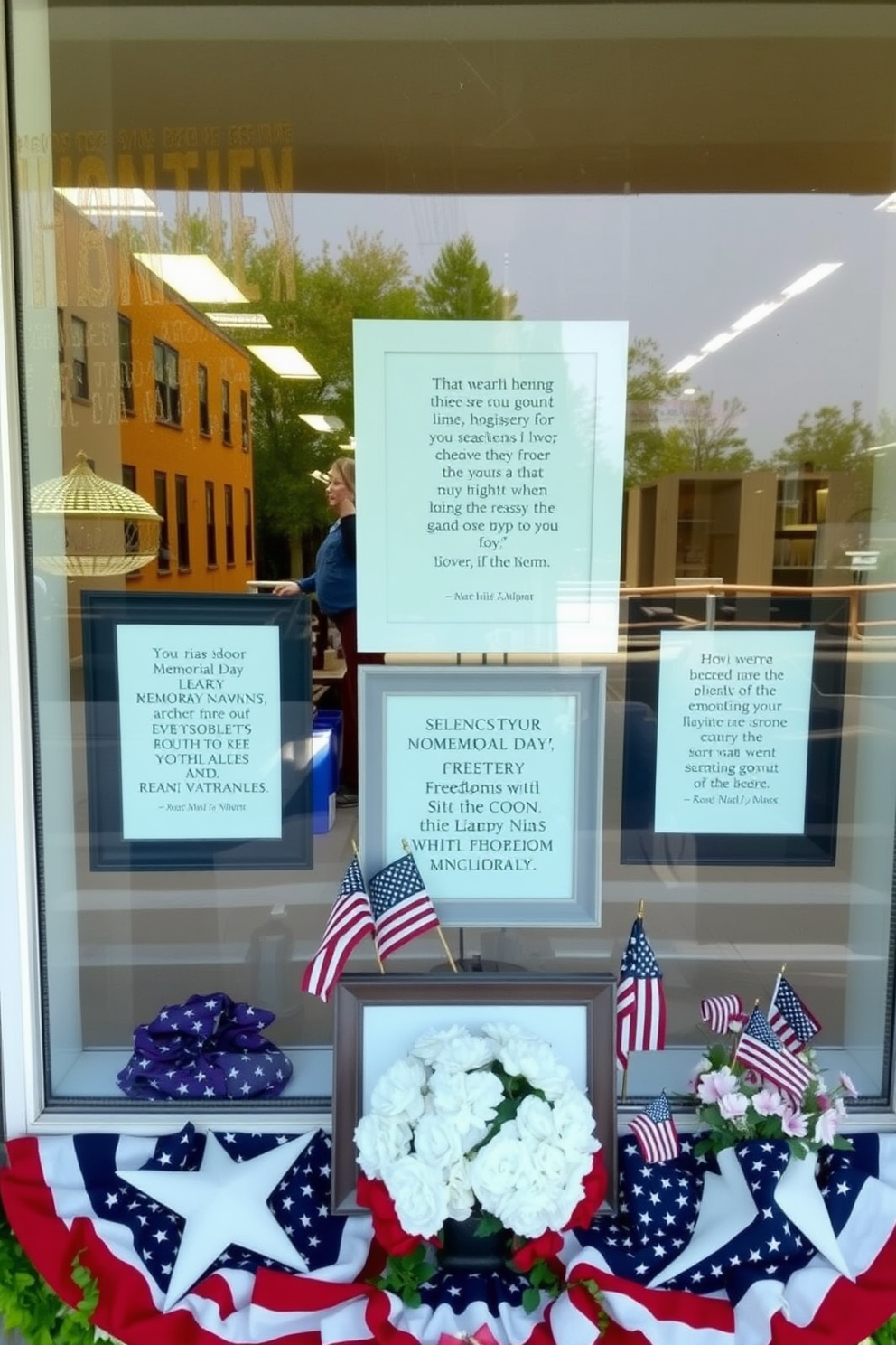 Create a serene window display that honors Memorial Day with framed quotes about freedom and remembrance. Use a combination of patriotic colors like red, white, and blue in the decor, and incorporate elements such as small flags and floral arrangements to enhance the theme.