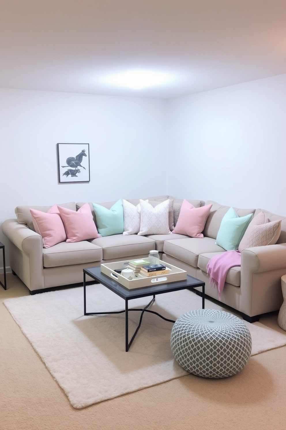 A cozy basement living area adorned with pastel colored throw pillows in soft shades of pink, mint, and lavender. A plush sectional sofa is complemented by a light area rug, creating a welcoming atmosphere perfect for relaxation and gatherings. The walls are painted in a light neutral tone, enhancing the brightness of the space. A small coffee table sits in the center, topped with a decorative tray and a few books, adding a touch of charm to the decor.