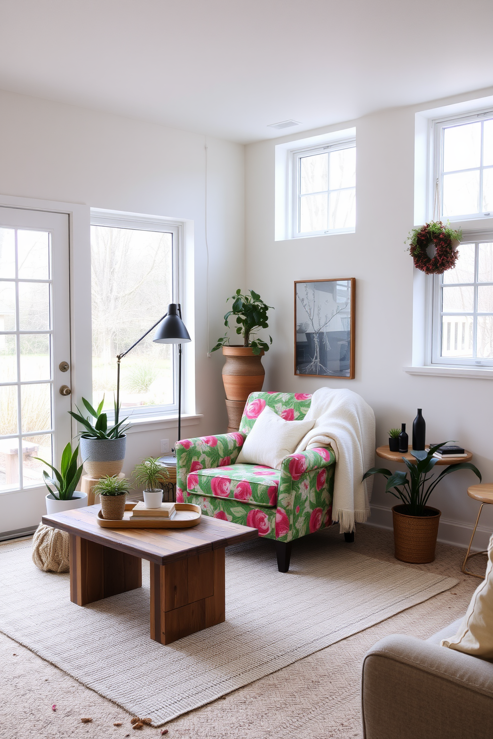 A cozy basement space designed for spring with light-colored walls and large windows allowing natural light to flood in. In the center, a vibrant accent chair in a bold floral pattern adds a pop of color, inviting relaxation and conversation. Surrounding the chair, there are potted plants and soft throw blankets to enhance the spring atmosphere. A small coffee table made of reclaimed wood sits nearby, perfect for enjoying drinks and snacks while entertaining guests.