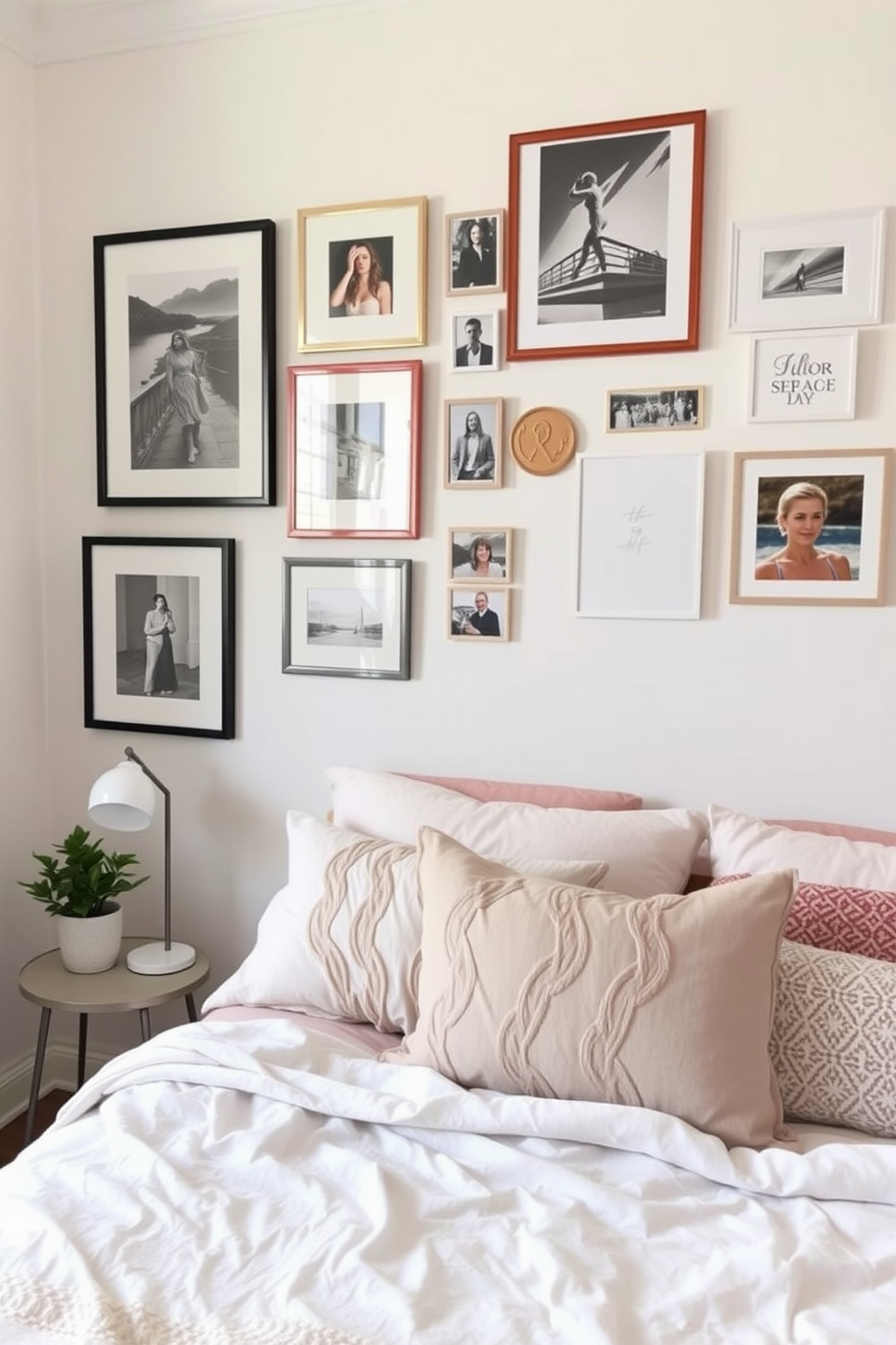 A serene bedroom featuring a gallery wall adorned with framed personal photographs and art pieces. The walls are painted in a soft pastel hue, creating a calming atmosphere that complements the cozy bedding. The bed is dressed in light, airy linens with decorative pillows in various textures. A bedside table holds a small plant and a stylish lamp, enhancing the overall warmth of the space.