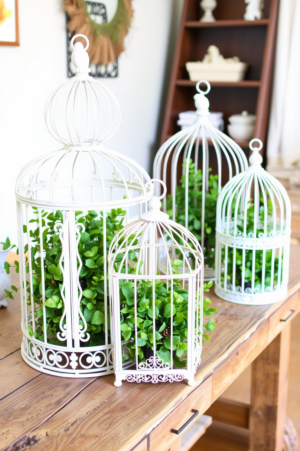 Decorative birdcages filled with faux greenery are artistically arranged on a rustic wooden table. The birdcages feature intricate designs and varying sizes, creating a charming focal point for a spring-themed interior.