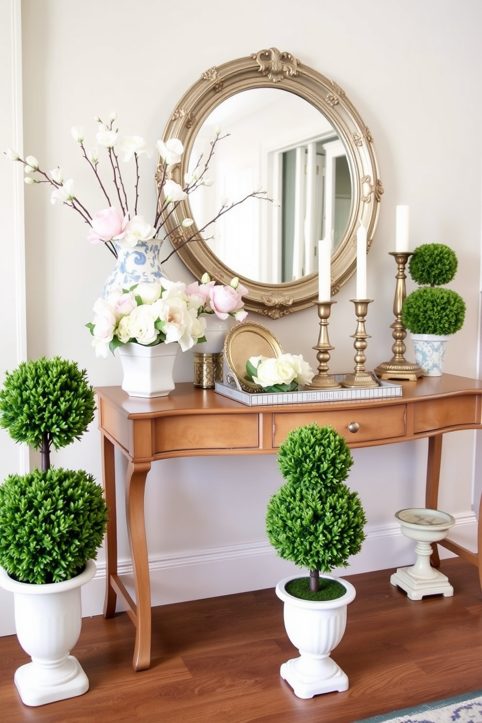 Miniature topiaries arranged in elegant ceramic pots create a classic touch in the entryway. The vibrant green foliage contrasts beautifully with the soft pastel colors of the surrounding decor. Delicate floral arrangements in pastel hues complement the topiaries, adding a fresh and inviting feel. A vintage console table adorned with decorative trays and candles enhances the overall charm of the spring entryway.