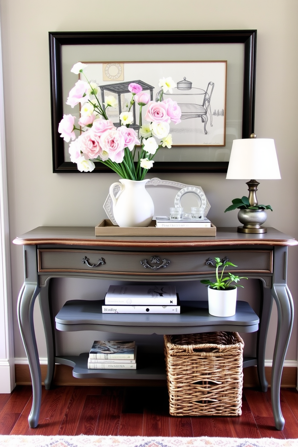 A vintage console table is adorned with fresh spring decor, featuring pastel-colored flowers in a ceramic vase. The tabletop is styled with a decorative tray, a stack of books, and a small potted plant, creating an inviting entryway atmosphere.