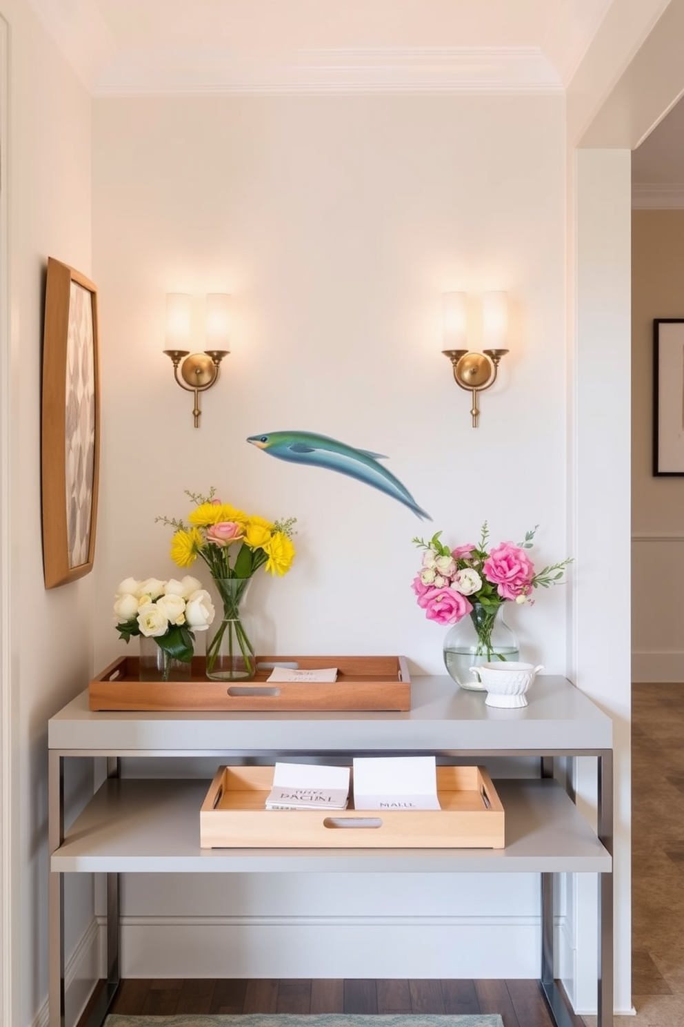 A stylish hallway adorned with decorative trays for keys and mail. The trays are made of natural wood and ceramic, placed on a sleek console table against a soft pastel wall. Fresh spring decor brings life to the space with vibrant floral arrangements and light-colored accents. A pair of elegant wall sconces illuminate the hallway, enhancing the cheerful ambiance.