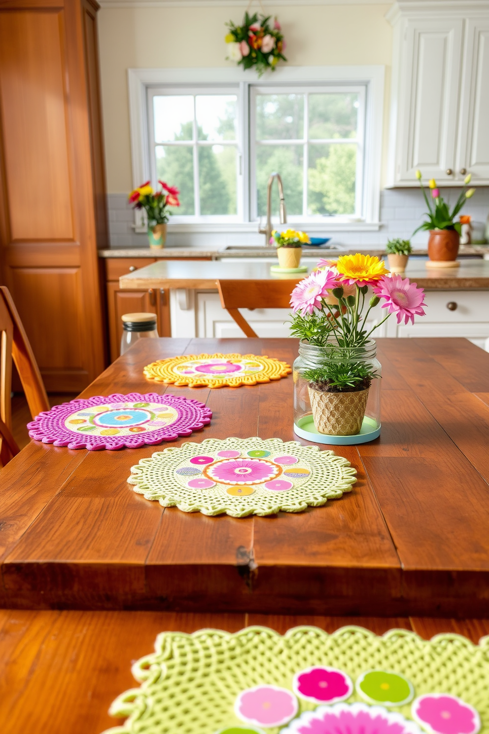 Brightly colored placemats and coasters are arranged on a rustic wooden dining table. The kitchen features vibrant spring-themed decorations with floral accents and fresh herbs in decorative pots.