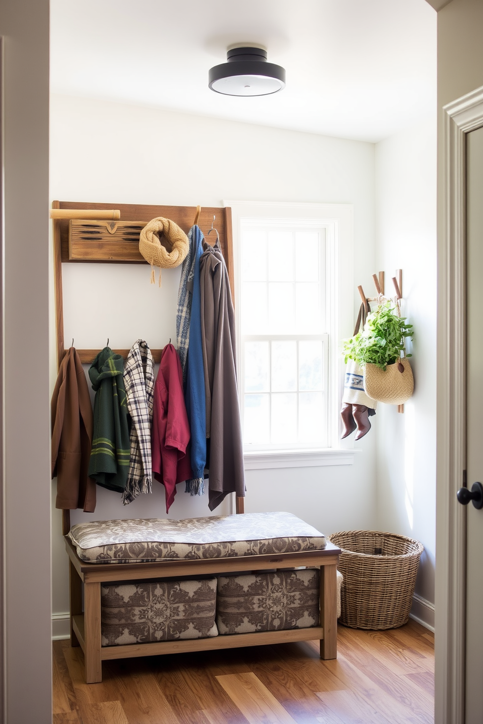 A welcoming mudroom filled with natural light. A wooden ladder is used creatively to hang various seasonal items like jackets and scarves, adding a rustic charm to the space. The walls are painted in a soft pastel hue, enhancing the airy feel of the room. A decorative bench with cushion seating sits below the ladder, providing a cozy spot for putting on shoes.