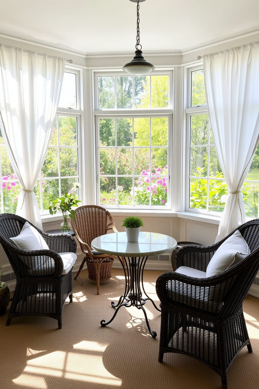 A bright and airy sunroom filled with natural light. In the center, a charming bistro table with wrought iron legs and a round marble top invites casual dining. Surrounding the table, comfortable wicker chairs with plush cushions create a cozy atmosphere. Large windows draped with sheer white curtains offer a view of blooming flowers and greenery outside.