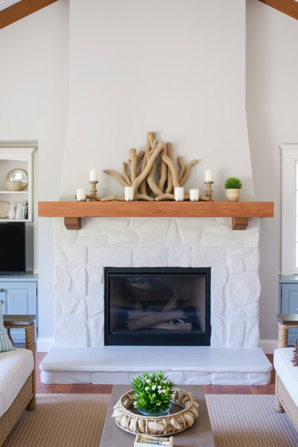 A cozy living room featuring a summer fireplace with a mantle adorned with driftwood accents. The fireplace is surrounded by light-colored stone and flanked by comfortable seating, creating an inviting atmosphere. On the mantle, pieces of driftwood are arranged artfully alongside candles and small potted plants. The overall color palette includes soft blues and sandy neutrals, evoking a serene coastal vibe.