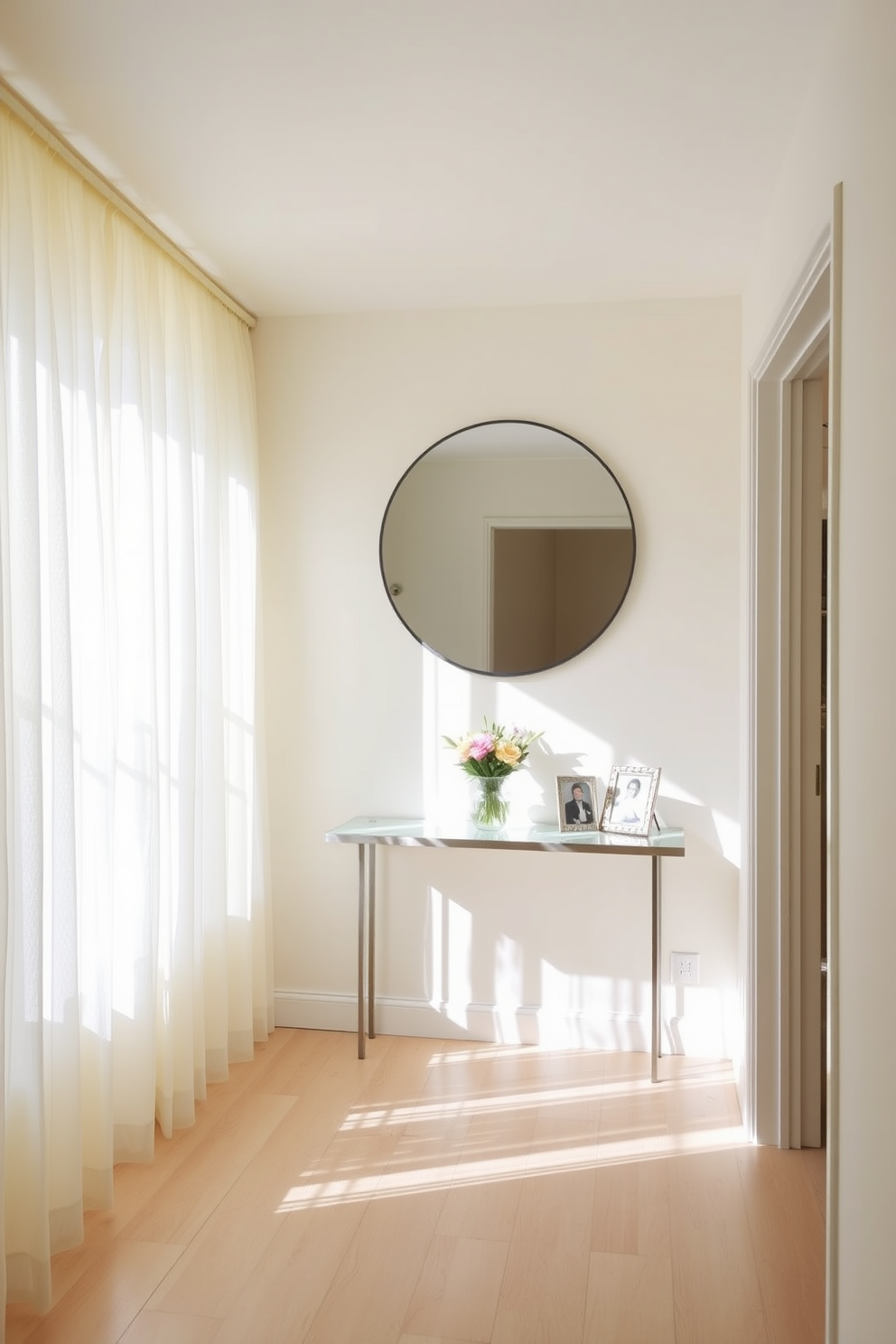 A bright and inviting hallway adorned with light airy curtains that gently filter sunlight. The walls are painted in a soft pastel hue, and the floor is covered with a light-colored hardwood that complements the overall brightness of the space. Decorative elements include a slim console table with a vase of fresh flowers and a few framed photos. A large round mirror hangs above the table, reflecting the natural light and creating a sense of openness.