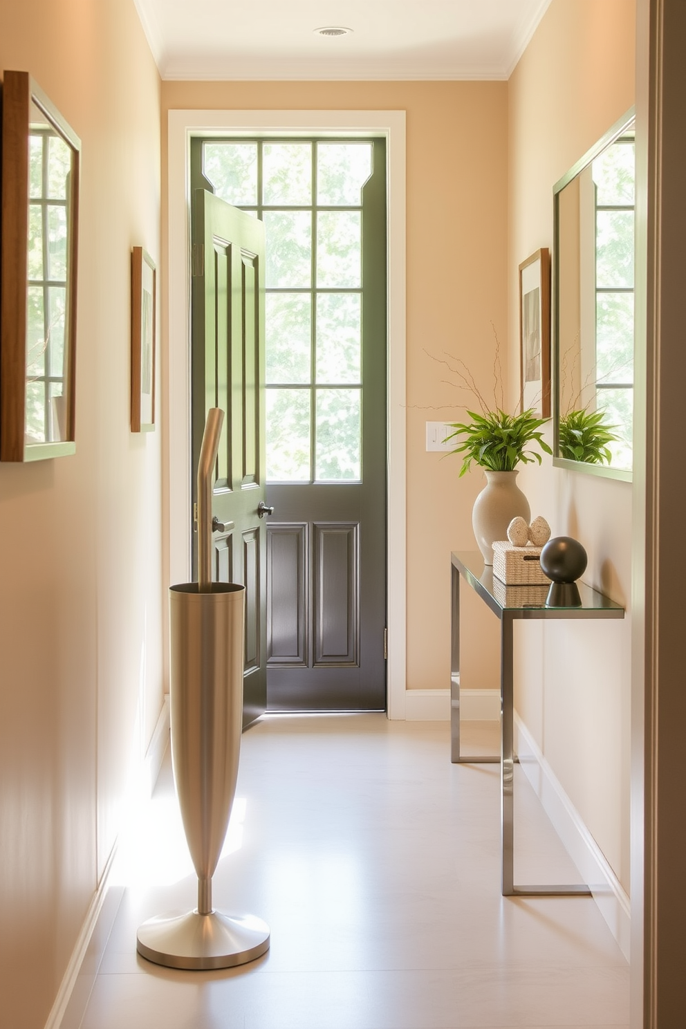 A bright and inviting hallway features soft beige walls adorned with framed artwork. A stylish umbrella stand made of brushed metal stands elegantly beside the door, ready to welcome guests. The hallway is illuminated by natural light streaming through a nearby window, highlighting a sleek console table adorned with decorative items. A small potted plant adds a touch of greenery, enhancing the fresh and welcoming atmosphere.