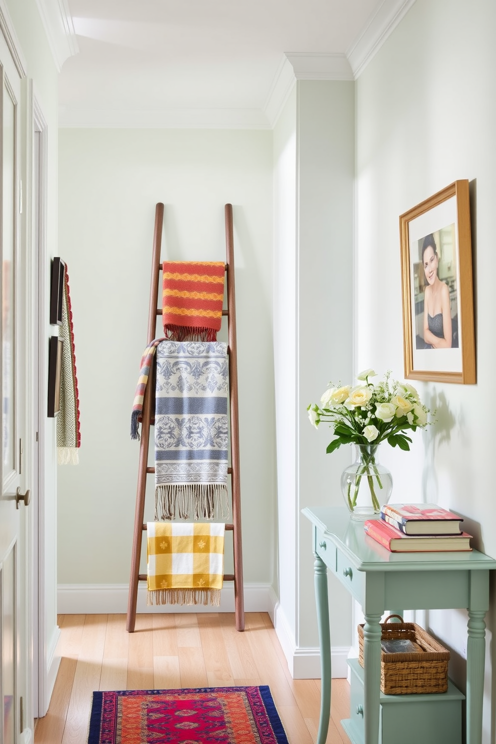 A bright and airy hallway adorned with a stylish ladder leaning against the wall. The ladder is draped with colorful decorative blankets, adding warmth and texture to the space. The walls are painted in a soft pastel hue, creating a cheerful atmosphere. A small console table is positioned nearby, topped with a vase of fresh flowers and a few carefully selected books.