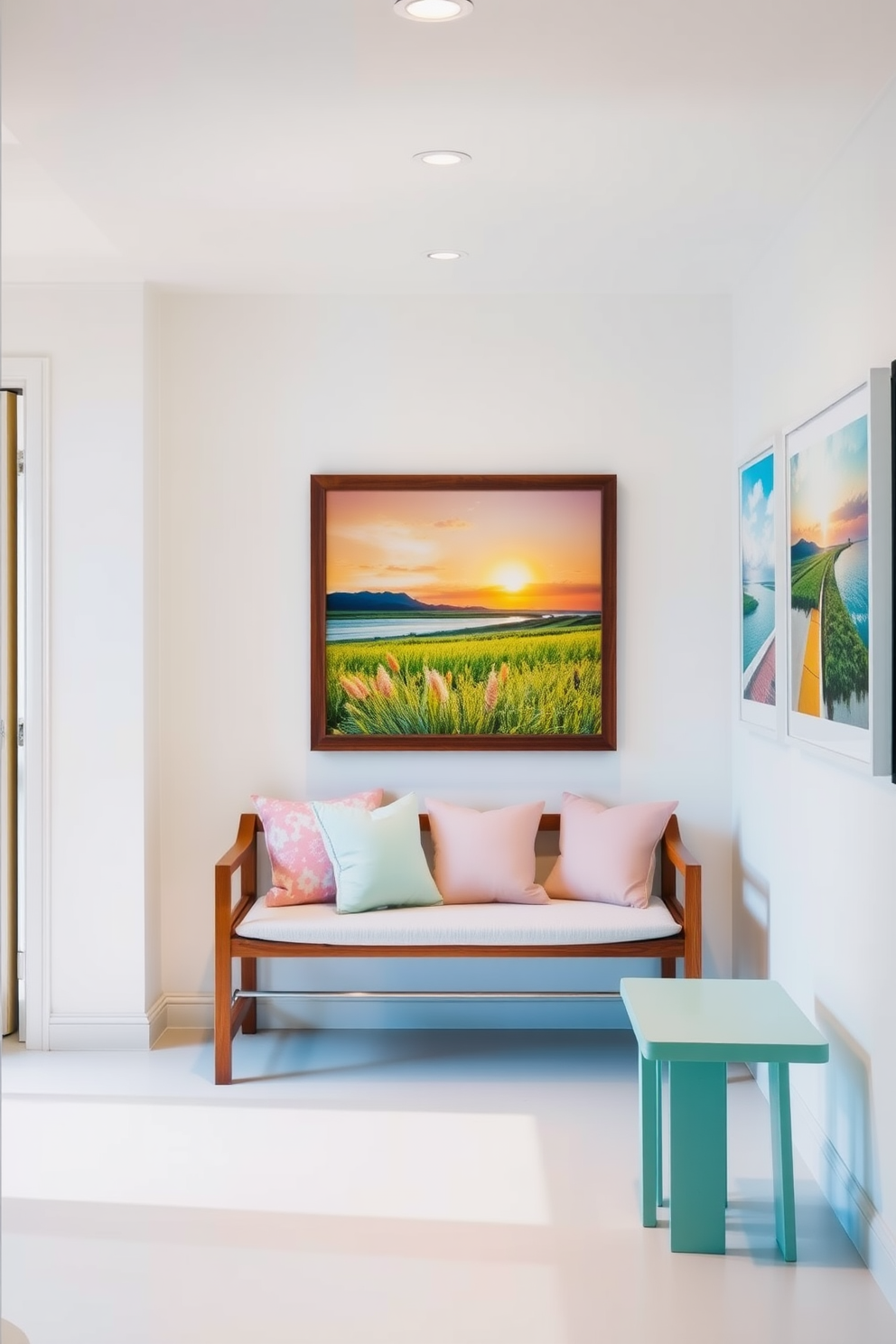 A bright and airy hallway features a sleek wooden bench adorned with plush cushions in soft pastel colors. The walls are decorated with framed artwork that showcases vibrant summer landscapes, creating a cheerful and welcoming atmosphere.