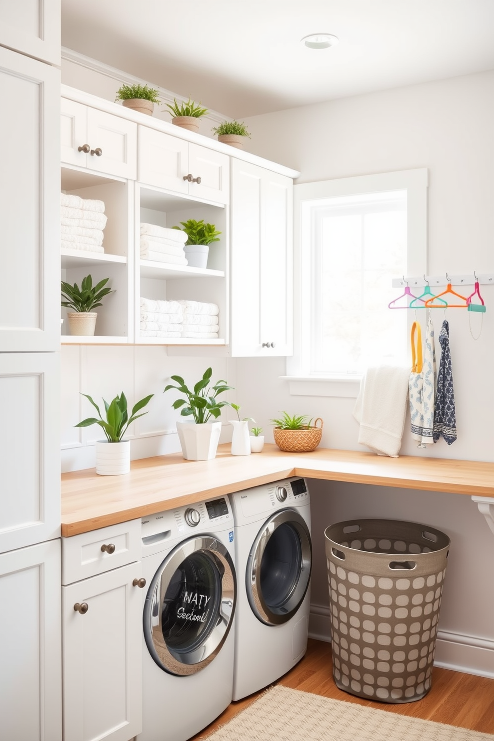 A bright and airy laundry room features white cabinetry and open shelving adorned with neatly folded towels. Indoor plants in decorative pots are placed on the shelves, adding a touch of freshness and vibrancy to the space. The countertop is made of light wood, providing a warm contrast to the cool tones of the room. A stylish laundry basket sits in one corner, while a wall-mounted peg rack holds colorful hangers for added functionality and charm.