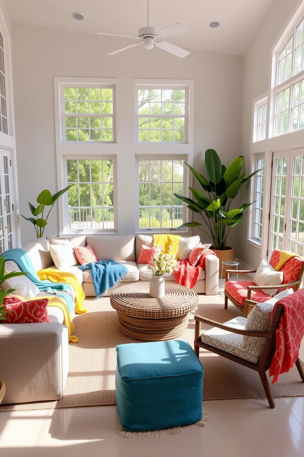 A bright and airy summer living room features a large, comfortable sofa adorned with colorful throw blankets in shades of blue, yellow, and coral. Large windows allow natural light to flood the space, enhancing the cheerful atmosphere and highlighting the vibrant decor. A woven coffee table sits at the center, surrounded by stylish accent chairs that complement the throw blankets. Potted plants in the corners add a touch of greenery, creating a refreshing and inviting environment.