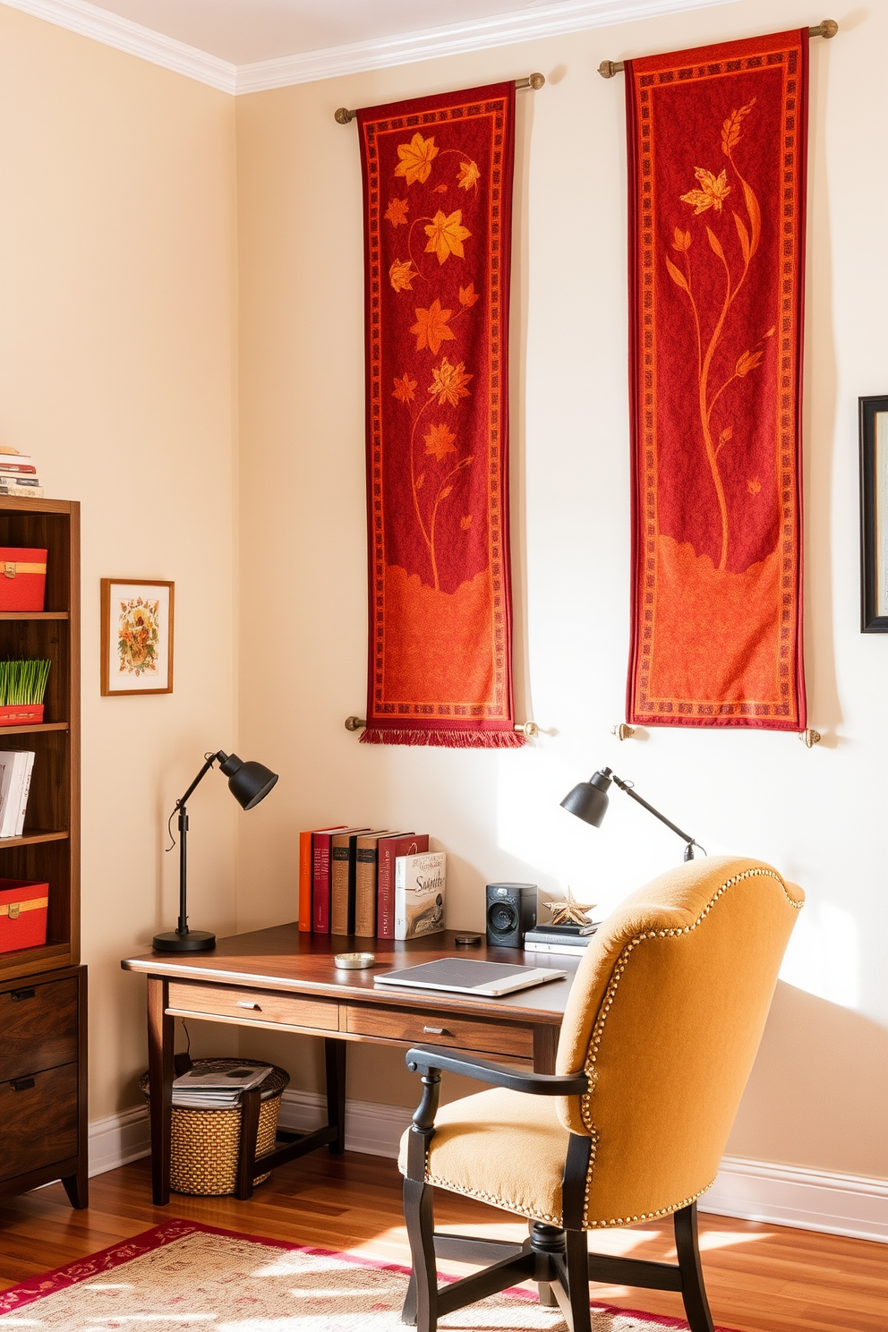 Fabric banners with warm autumn motifs hang gracefully across the walls of a cozy home office. The space is adorned with rich hues of orange and gold, complemented by a wooden desk and a plush chair, creating an inviting atmosphere for productivity.