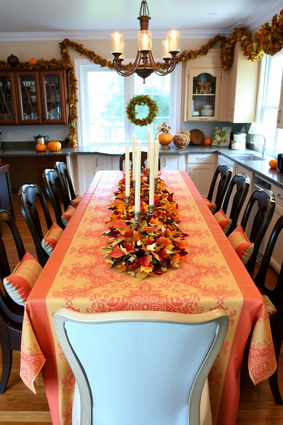 A festive tablecloth in warm hues covers a long wooden dining table adorned with seasonal decorations. Surrounding the table are elegant chairs with plush cushions, creating an inviting atmosphere perfect for Thanksgiving gatherings. On the table, a centerpiece of autumn leaves and candles adds a touch of warmth and charm. The kitchen is decorated with garlands of dried corn and pumpkins, enhancing the festive spirit of the holiday.