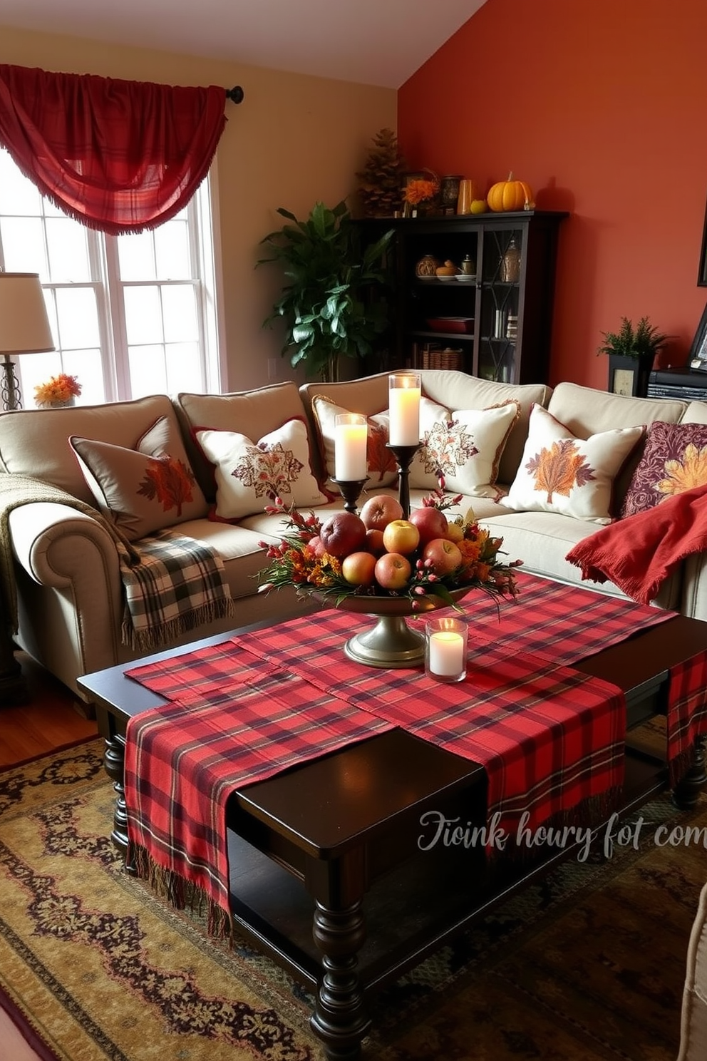 A warm and inviting living room adorned for Thanksgiving. A cozy sofa is complemented by plaid table runners draped across the coffee table, adding a festive touch to the decor. Rich autumn colors dominate the space, with decorative pillows featuring fall motifs scattered across the sofa. A centerpiece of seasonal fruits and candles enhances the inviting atmosphere, creating a perfect setting for family gatherings.