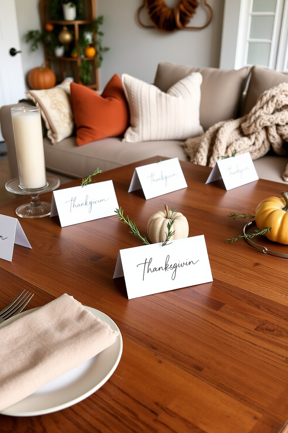 Handwritten place cards elegantly arranged on a rustic wooden table set for Thanksgiving. Each card features beautiful calligraphy and is adorned with a small sprig of rosemary, adding a personal touch to the festive decor. A cozy loft space decorated with warm tones and soft textures for a Thanksgiving gathering. Plush throw pillows and a chunky knit blanket are draped over a stylish sofa, creating an inviting atmosphere for family and friends.