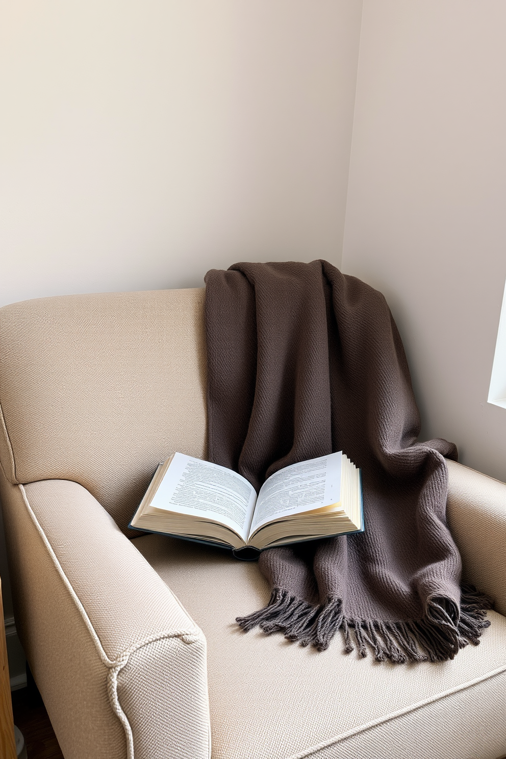 A cozy reading nook featuring a comfortable armchair upholstered in soft fabric. A warm throw is draped over the armrest, inviting relaxation and enjoyment of a good book.