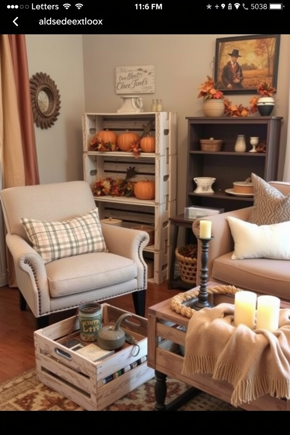 A charming small living room decorated for Thanksgiving features vintage wooden crates used as display stands. One crate is stacked beside a cozy armchair, showcasing seasonal decorations like pumpkins and autumn leaves, while another crate serves as a coffee table adorned with candles and a warm throw blanket.