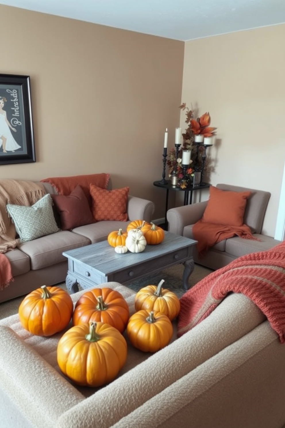 A cozy living room designed for Thanksgiving celebrations. The space features a small coffee table adorned with a centerpiece of vibrant pumpkins in various sizes, surrounded by soft, warm throws on a plush sofa. The walls are painted in a warm beige tone, creating an inviting atmosphere. A decorative arrangement of autumn leaves and candles complements the seasonal decor, enhancing the festive feel of the small space.