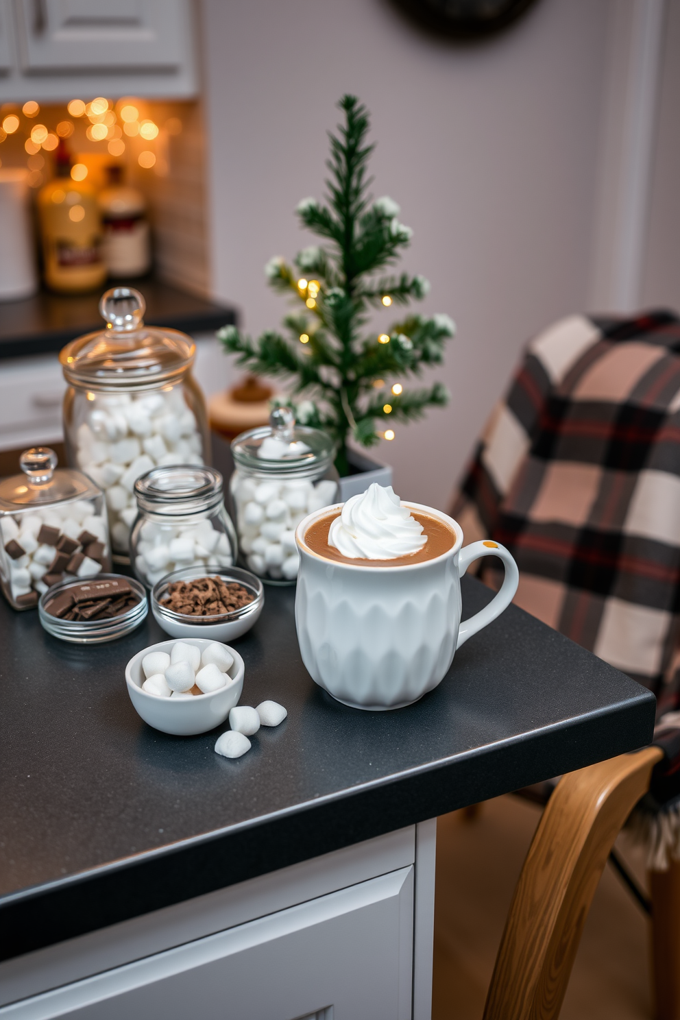 A cozy hot cocoa station is set up on the kitchen counter featuring a charming ceramic mug filled with rich cocoa topped with whipped cream. Surrounding the mug are various toppings like marshmallows and chocolate shavings, all displayed in elegant glass jars. The counter is adorned with festive winter decorations including a small evergreen tree and twinkling fairy lights. A soft plaid blanket drapes over a nearby chair, inviting warmth and comfort into the winter apartment setting.