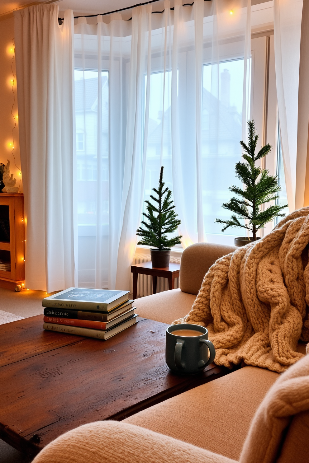 A cozy winter apartment setting filled with warmth and charm. A stack of well-loved books sits on a rustic wooden coffee table, accompanied by a steaming mug of cocoa and a soft knitted blanket draped over the arm of a plush sofa. The windows are adorned with sheer white curtains that allow soft natural light to filter in. A small evergreen tree in a decorative pot adds a touch of greenery, while fairy lights twinkle gently around the room, creating a welcoming ambiance.