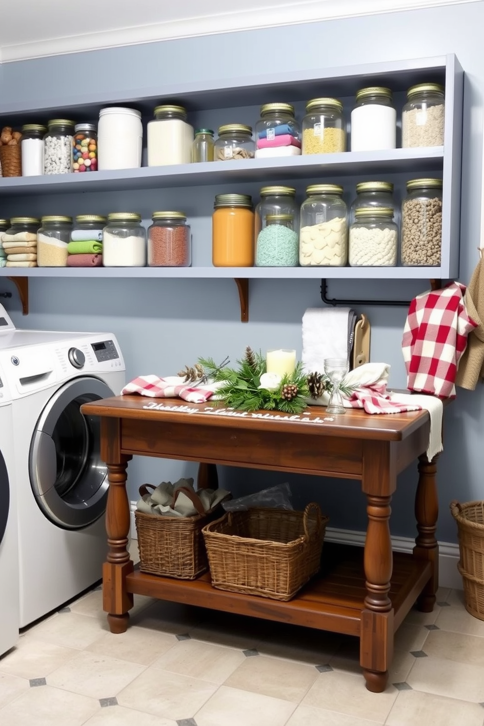 A cozy laundry room features glass jars filled with colorful laundry supplies neatly arranged on open shelves. The walls are painted in a soft blue hue, and a vintage wooden table serves as a folding station, adorned with seasonal winter decor.