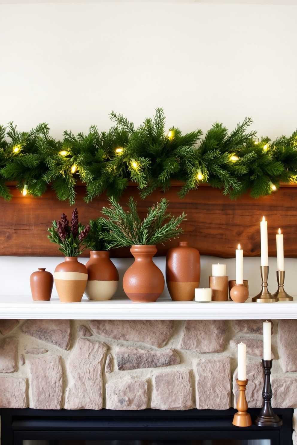 A cozy winter mantel decorated with earthy tones and natural wood accents. The mantel features a rustic wooden beam adorned with pine garlands and twinkling fairy lights. On one side, a collection of handmade ceramic vases in warm browns and greens holds seasonal foliage. On the other side, a cluster of candles in varying heights adds a soft glow to the space.