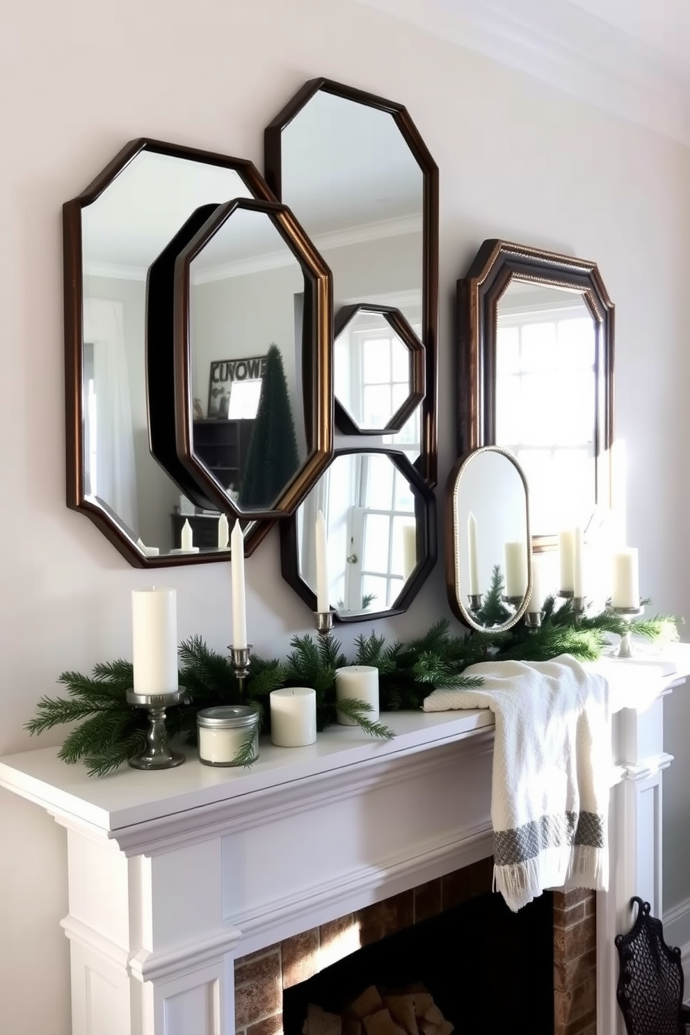 Layered mirrors are arranged on the wall to beautifully reflect the soft winter light streaming in through the windows. The mirrors vary in size and shape, creating a dynamic focal point that enhances the room's brightness. The mantel is adorned with seasonal decorations, including pine branches and white candles of varying heights. A cozy throw blanket drapes over one end, inviting warmth and comfort into the space.